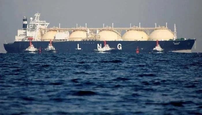 FILE – A liquefied natural gas (LNG) tanker is tugged towards a thermal power station in Futtsu, east of Tokyo, Japan.