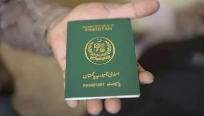 A person holding a Pakistani passport.